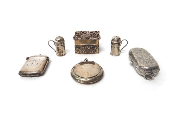 Silver, comprising; a pair of miniature kitchen pepperettes with scrolling handles, London 1984, a twin compartment sovereign case having engraved dec