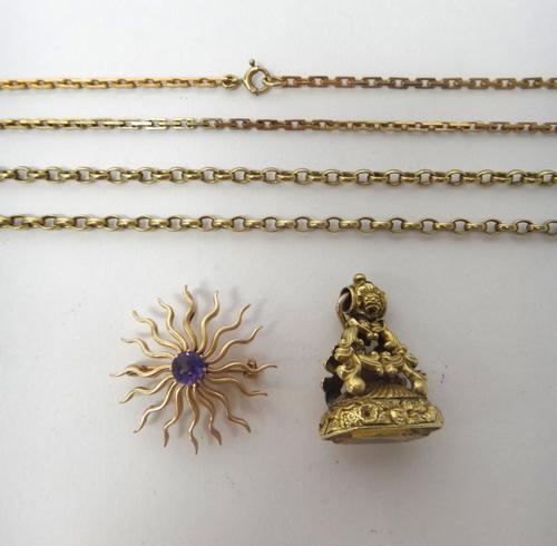 A 9ct gold oval link neckchain, on a boltring clasp, a 9ct gold faceted oval link neckchain, on a boltring clasp, a gold brooch, designed as a sunburs