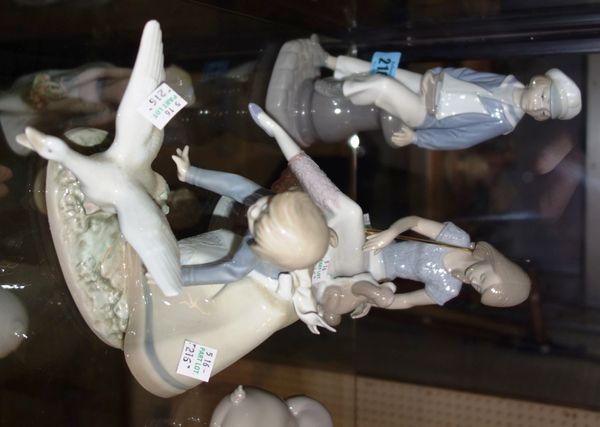 A group of three Lladro figures 'Note Escaparas', 'Picture Perfect' and 'Marinerito'. (3)