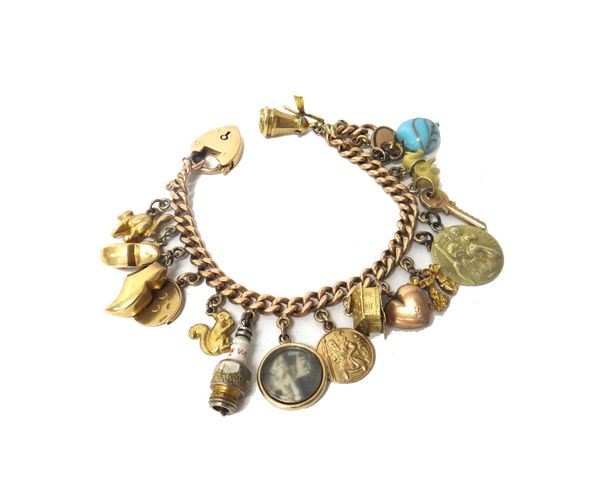 A 9ct gold, curb link charm bracelet, with a gold heart shaped padlock clasp, fitted with seventeen gold and other pendants and charms, including; a w