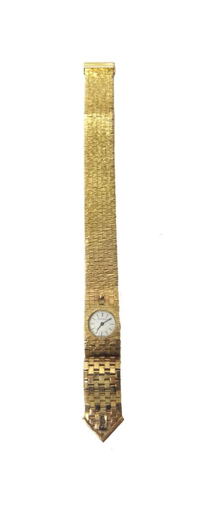 A lady's 9ct gold Bueche-Girod bracelet wristwatch, the signed circular white dial with black baton shaped numerals, on a bark textured brick link bra