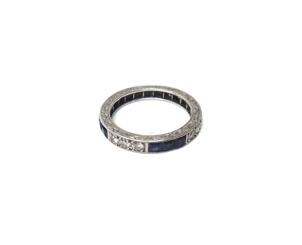 A diamond and sapphire set full eternity ring, mounted with rows of three circular cut diamonds, alternating with rows of three calibre cut sapphires,