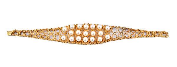 A gold and cultured pearl bracelet, cast and pierced in a tapering textured design, the front mounted with three rows of cultured pearls, on a snap cl