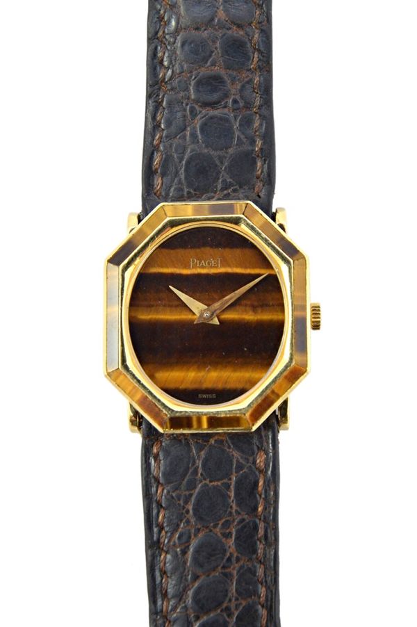 A lady's gold and tiger's eye Piaget dress wristwatch, with an unsigned oval tiger's eye dial, within an octagonal tiger's eye border, fitted to a bro