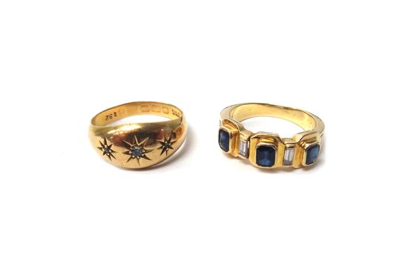 A gold ring, mounted with three cut cornered rectangular cut sapphires and with four baguette diamonds, mounted at intervals, ring size N and an 18ct