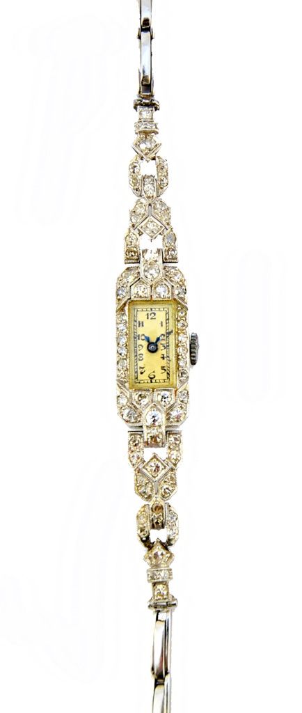 A lady's platinum cased and diamond set bracelet wristwatch, with an unsigned movement, the rectangular dial with black Arabic numerals, the case surr