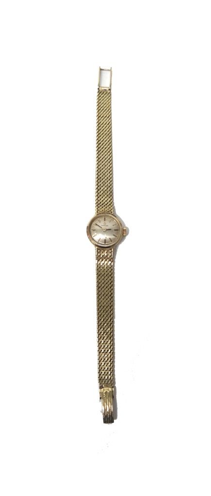 A lady's gold Omega bracelet wristwatch, the signed circular silvered dial with baton shaped numerals, on a woven mesh link gold bracelet, with a fold