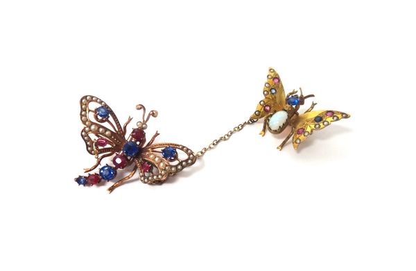 Two gold, seed pearl, opal, ruby, sapphire and gem set scatter pins, each designed as a differing butterfly connected by a chain.