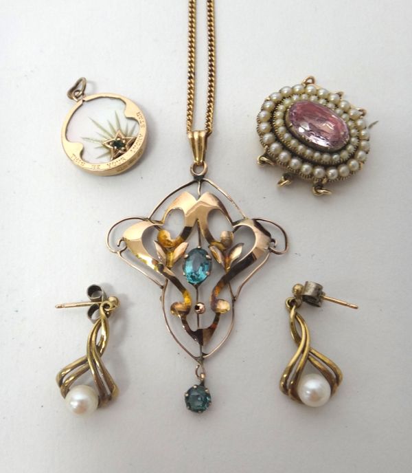 A gold and pale blue gem set pendant, in a pierced openwork design, with a gold curb link neckchain, on a cylindrical clasp, a gold, seed pearl and pi