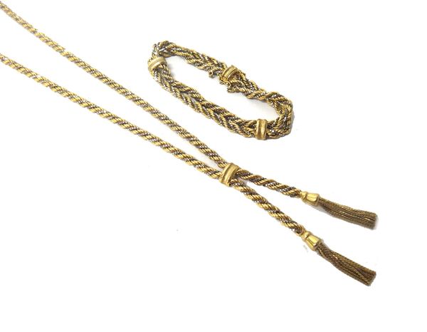 A 9ct two colour gold ropetwist link necklace, the front with two pendant tassel drops and a 9ct two colour gold ropetwist link bracelet, on a snap cl