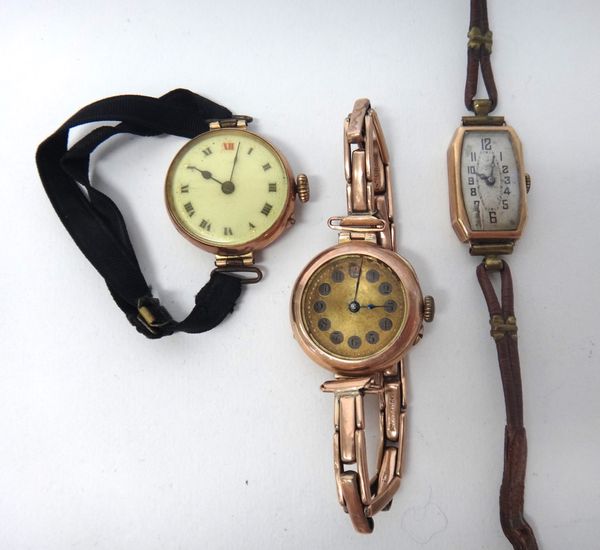 A lady's 9ct gold circular cased wristwatch, Birmingham 1917, on a gold sprung curved bar link bracelet, a lady's 9ct gold circular cased wristwatch,