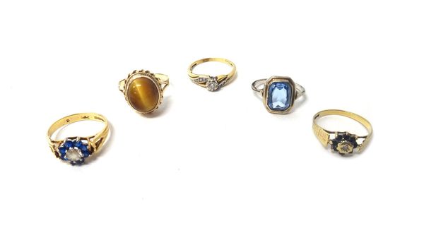 A 9ct gold ring, mounted with the principal circular cut diamond to the centre, between diamond set three stone scrolling shoulders, a tiger's eye set