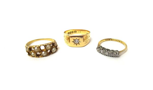 A gold and platinum, diamond set five stone ring, mounted with a row of cushion shaped diamonds, graduating in size to the centre stone, detailed 18 C