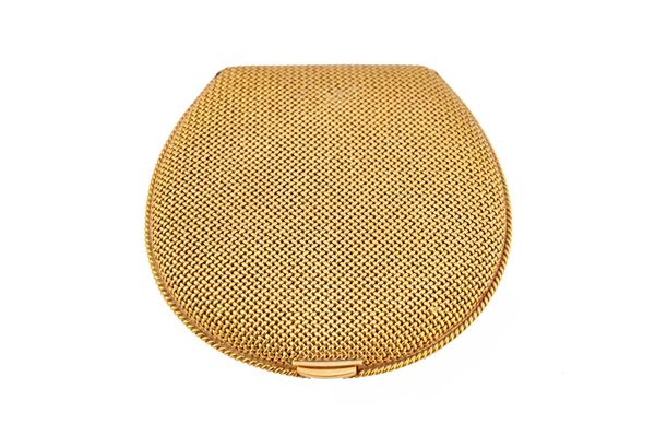 A lady's gold powder compact, of woven mesh link form, having a ropetwist wirework border to the base, detailed 750, the interior fitted with a circul