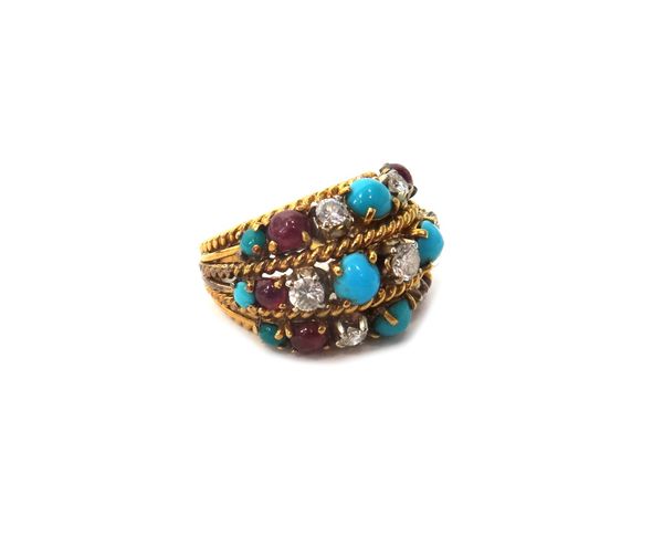 A gold, diamond, cabochon ruby and turquoise set ring, in a three row wirework design, mounted with the principal circular cut diamond at the centre a