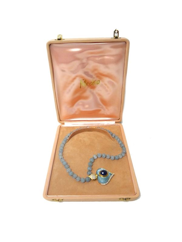 A gold, aquamarine, diamond and sapphire set pendant necklace, the heart shaped pendant centred by an oval cut sapphire, on a cabochon aquamarine grou