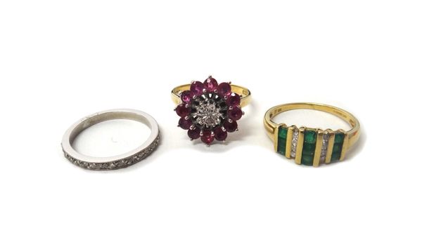 A 9ct gold, emerald and diamond set ring, mounted with three rows of emeralds and with two rows of four circular cut diamonds, a 9ct gold ring, mounte