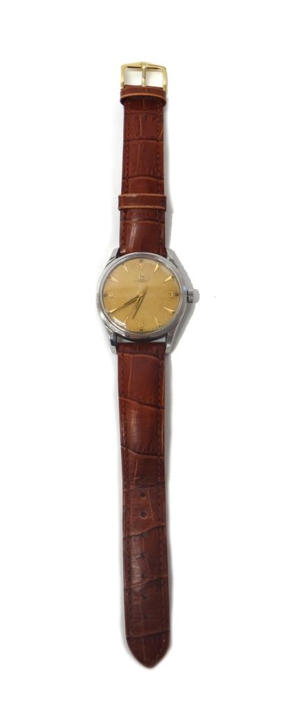 A gentleman's circular steel cased Omega wristwatch, the signed circular dial with gilt Arabic and arrow shaped numerals, tapering gilt hands and with