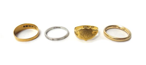 A platinum wedding ring, weight 2.8 gms, a gold wedding ring, detailed 9 C, weight 3.9 gms, an 18ct gold band ring, of tapering design, weight 2.1 gms