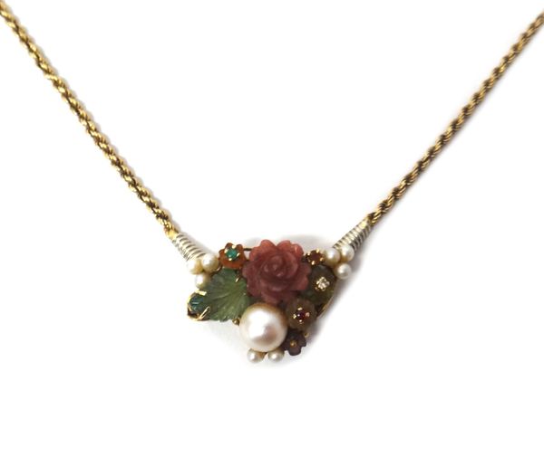 An Italian gold, faceted and carved gemstone and cultured pearl set necklace, the front in a floral and foliate design, mounted with a variety of gems