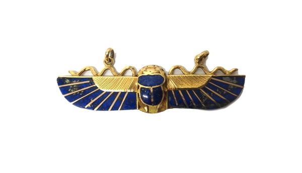 An Egyptian gold and lapis lazuli pendant, formed as a winged scarab, in the ancient Egyptian style, fitted with two oval suspension loops to hold a c