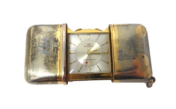 A Movado Ermetophon rectangular cased folding travelling alarm watch, the signed square silvered dial with gilt baton shaped numerals, detailed to the