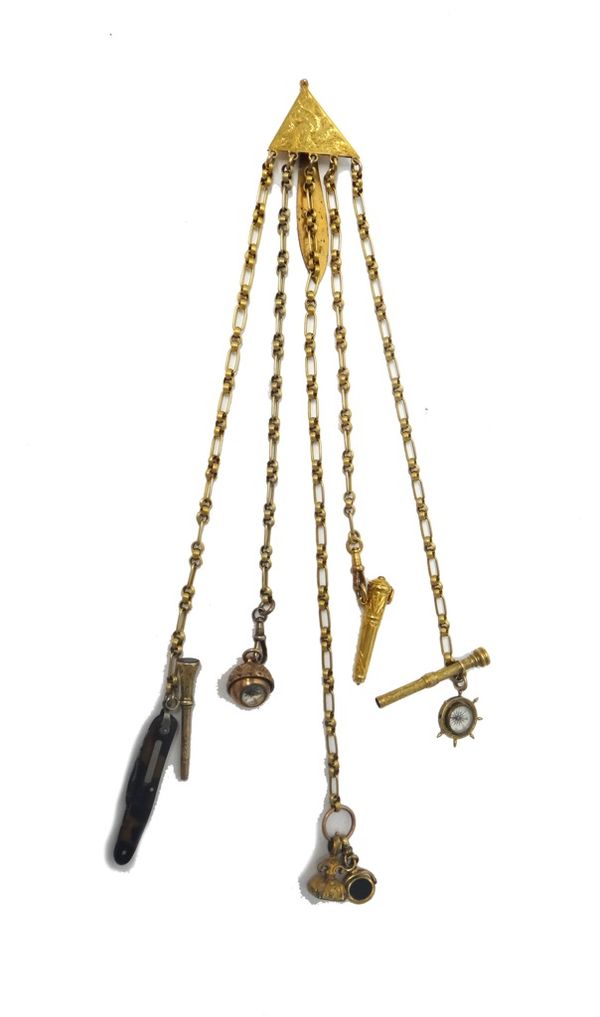 A Victorian gilt metal chatelaine, the triangular top with scroll engraved decoration, detailed to the back Biddlecombe, Yarmouth, fitted with five ch