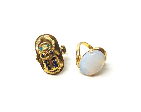 An Egyptian gold, lapis lazuli and turquoise set dress ring, formed as a scarab beetle (one lapis lazuli lacking), ring size R, gross weight 14.4 gms