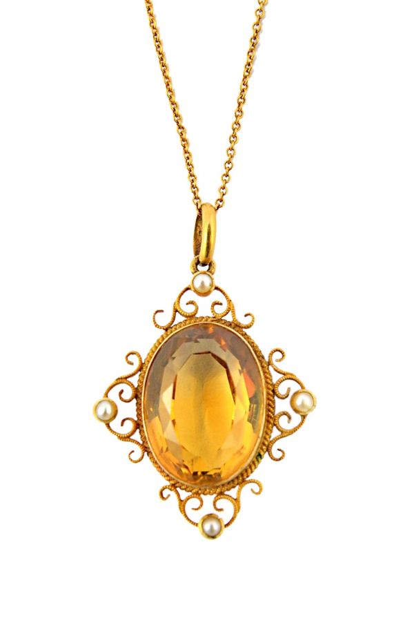 A gold, citrine and half pearl set pendant, mounted with the oval cut citrine at the centre, within a scroll pierced surround, mounted with four half