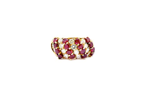 A gold, ruby and diamond set ring, mounted with four rows of four circular cut rubies, alternating with four rows of four circular cut diamonds, in a