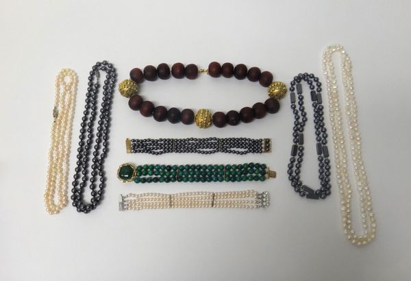 A three row bracelet of imitation malachite beads, on a malachite set circular clasp, two haematite bead necklaces, a four row bracelet of haematite b