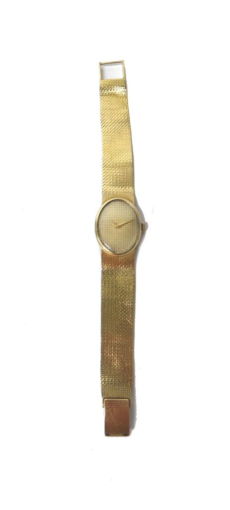 A lady's 18ct gold oval cased bracelet wristwatch, the unsigned oval gilt dial having textured decoration, on a woven mesh link bracelet, with a foldo