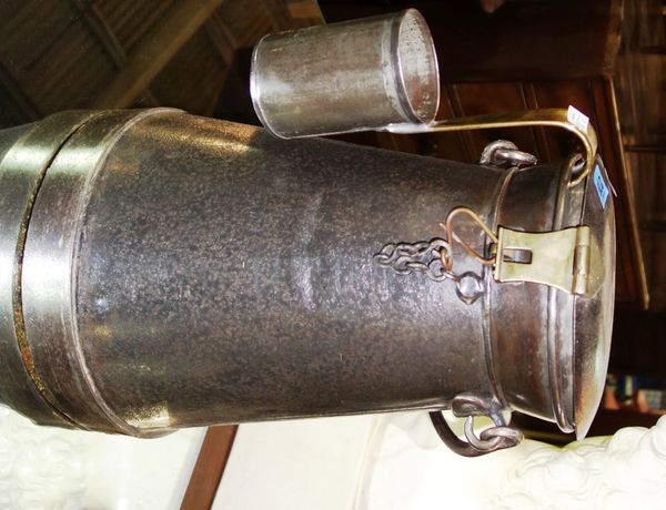An early 20th century steel and brass milk delivery pail and ladle.