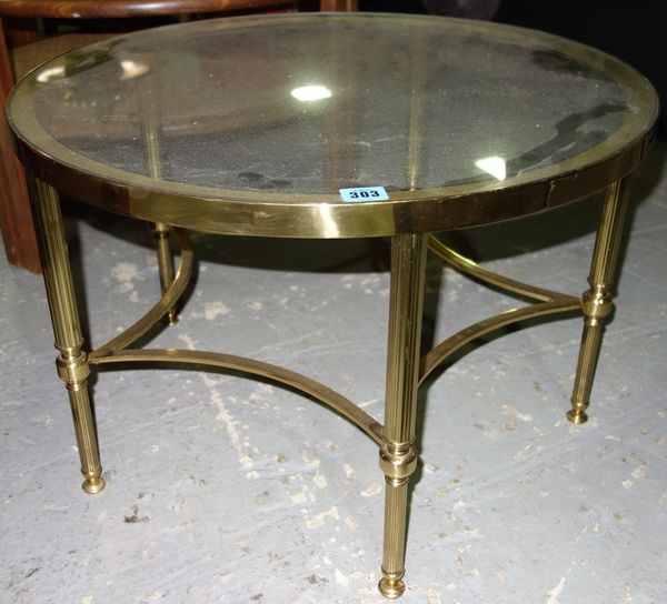 A 20th century brass and glass circular coffee table.