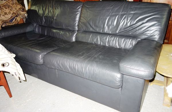 A 20th century grey leather upholstered three seat sofa.