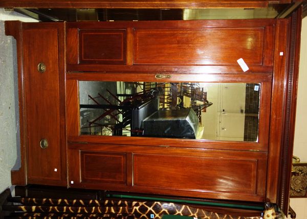 A 20th century mahogany triple section wardrobe.