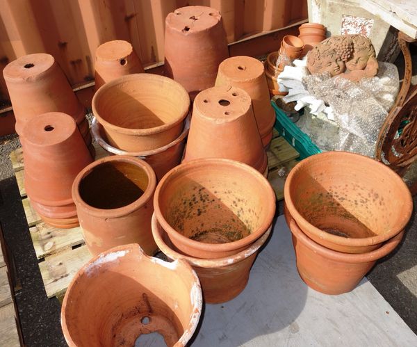 A large quantity of assorted terracotta pots of various sizes.