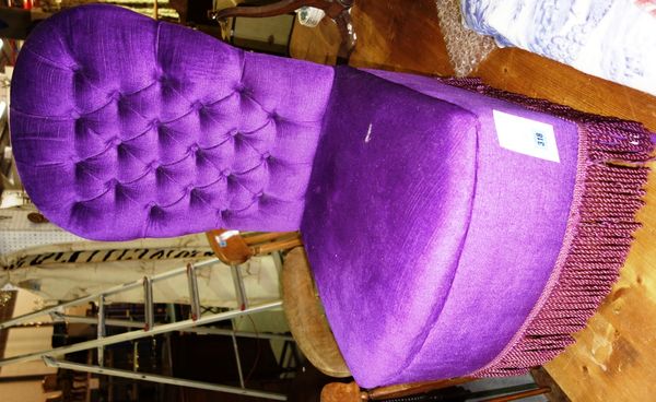 A purple upholstered nursing chair.