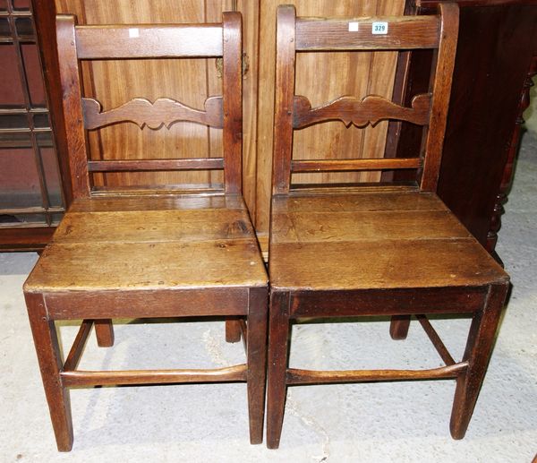 A pair of 18th century oak dining chairs. (2)