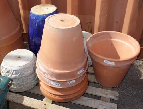 A group of five large terracotta plant pots and a pair of reconstituted stone planters molded with deer and a tall blue glazed pot. (8)