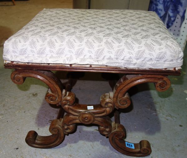 A Continental walnut 'X' frame stool.
