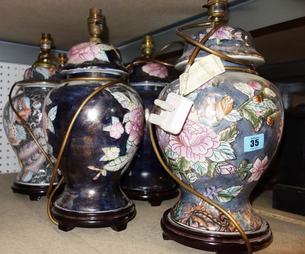 A group of five 20th century ceramic table lamps with floral decoration. (5)