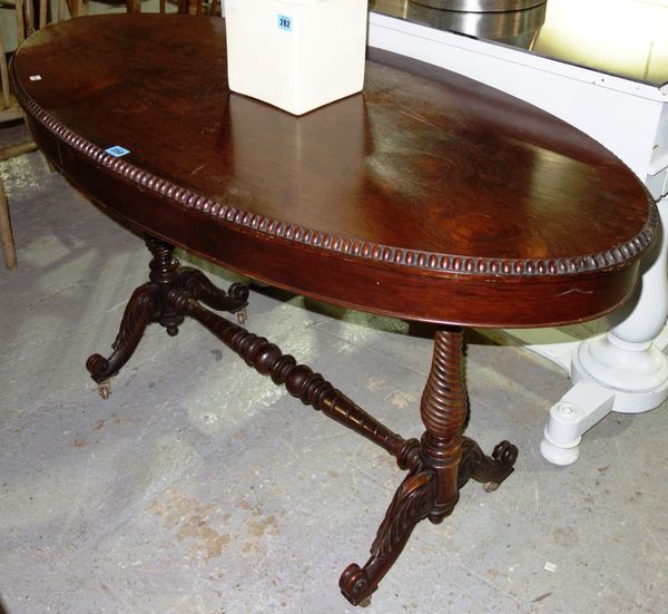 A 19th century oval oak centre table with gadrooned edge.