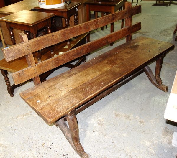A pair of teak framed benches.