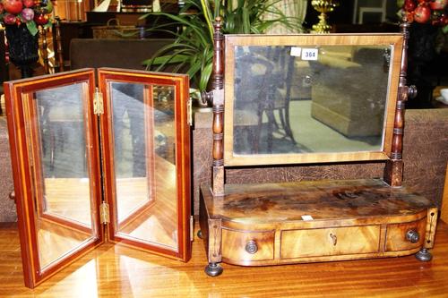 A Victorian mahogany swing frame toilet mirror with three drawer base, together with an Edwardian mahogany inlaid folding mirror. (2)