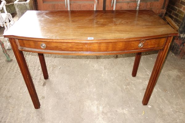An 18th century mahogany bowfront side table with single frieze drawer on channelled square supports, 108cm wide.