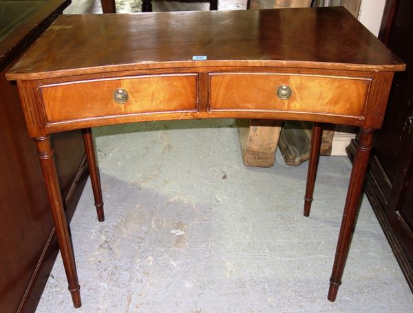 A 20th century concave mahogany side table.
