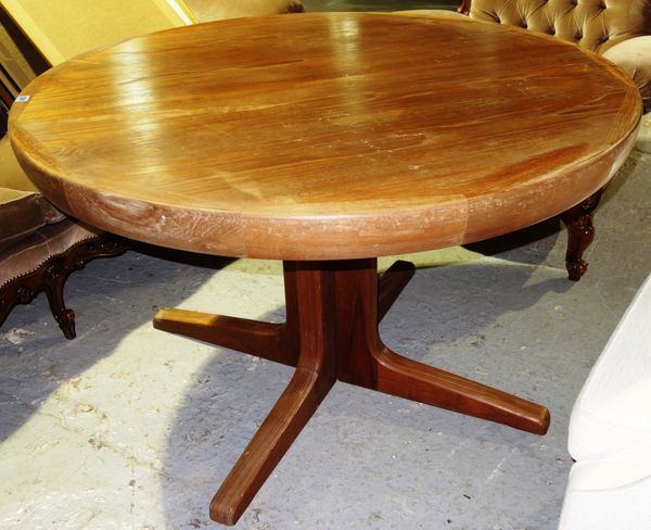 A 20th century teak circular table.