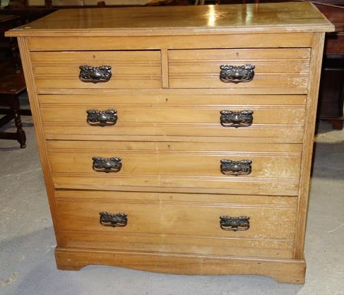 An Edwardian chest of two short and three long drawers.