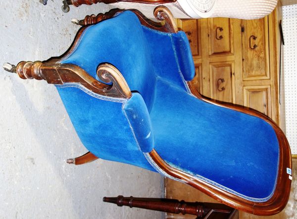 A 19th century mahogany and blue upholstered spoon back armchair.